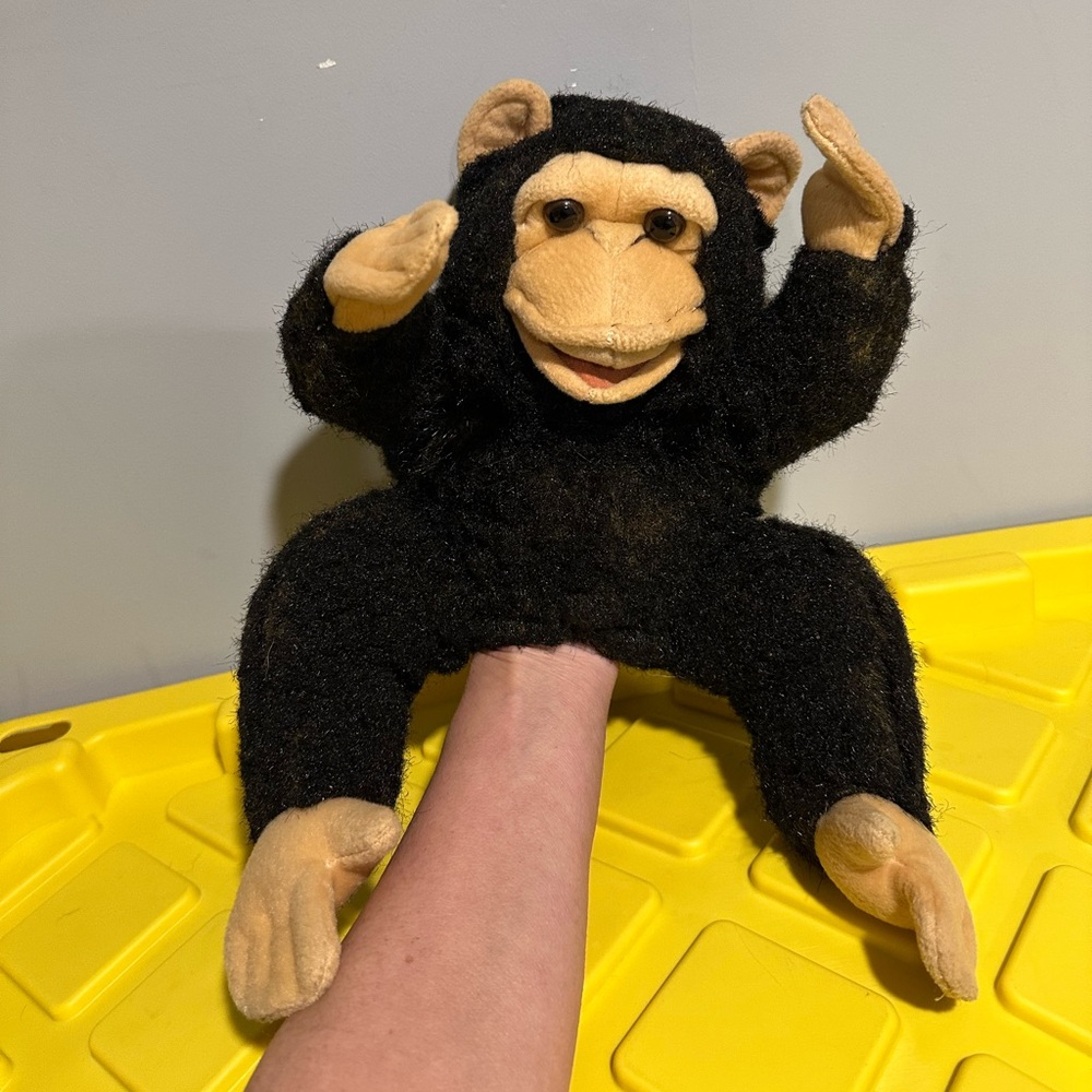 This adorable Folkmanis baby Chimpanzee is a huggable puppet